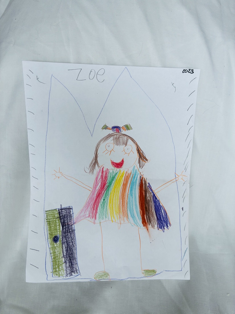 Crayon drawing of a smiling girl in a rainbow-striped dress with arms outstretched, signed Zoe 2025