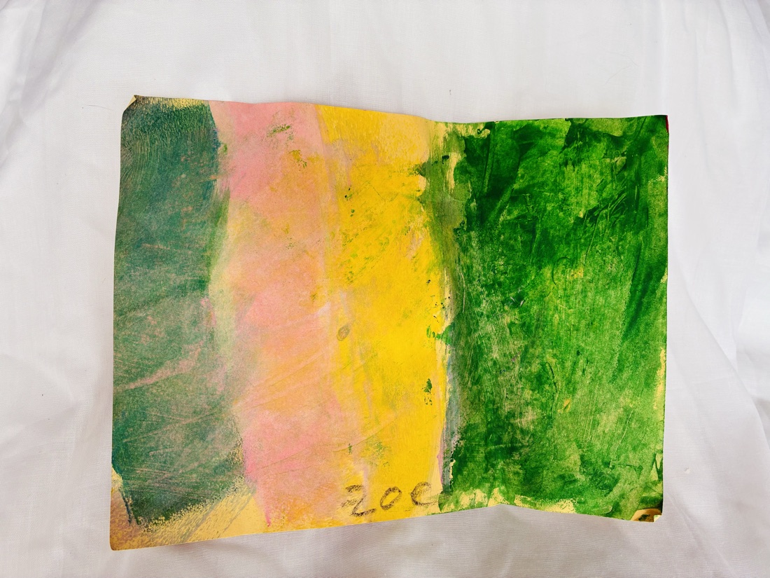 An abstract print of soft vertical bands of teal, pink, yellow and green